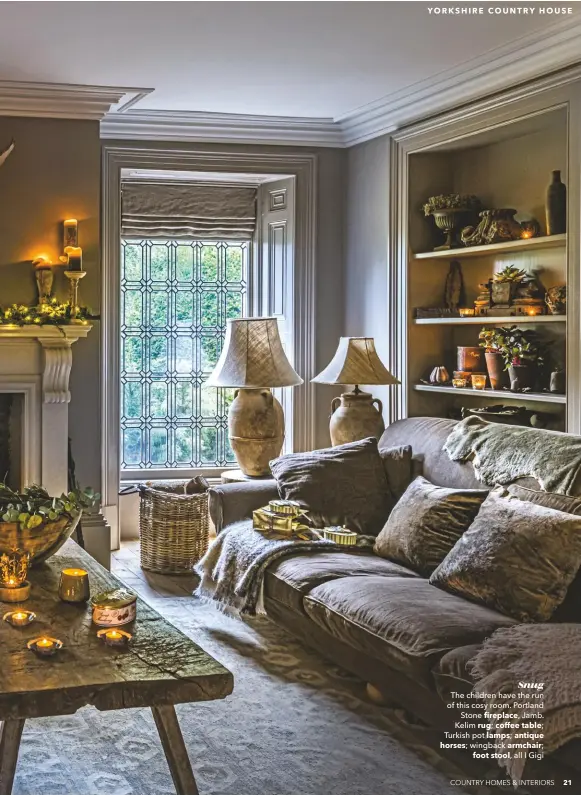  ??  ?? Snug The children have the run of this cosy room. Portland Stone fireplace, Jamb. Kelim rug; coffee table; Turkish pot lamps; antique horses; wingback armchair; foot stool, all I Gigi