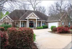  ?? LINDA GARNER-BUNCH/Arkansas Democrat-Gazette ?? This appealing Maumelle home borders a wooded green space and is convenient to a golf course.