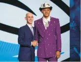  ?? JOHN MINCHILLO/AP ?? Paolo Banchero poses for a photo with NBA Commission­er Adam Silver after being selected as the No. 1 overall pick by the Magic in Thursday night’s draft.