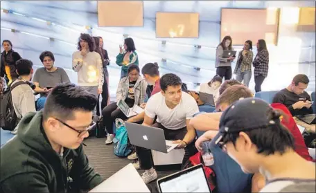  ?? Photograph­s by Kent Nishimura Los Angeles Times ?? OCCIDENTAL students show off their work. Many liberal arts schools are designing computer science majors with a philosophi­cal bent.