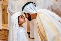  ??  ?? EID MUBARAK: Sheikh Mohammed bin Rashid exchanges Eid greetings with a young well-wisher, who was one of the many who came to celebrate the joyous occasion at the Zaabeel Palace in Dubai on Sunday