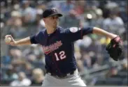  ?? JULIO CORTEZ ?? Minnesota Twins starting pitcher Jake Odorizzi throws a pitch to New York Yankees’ Mike Tauchman during the third inning of a baseball game, Saturday in New York.