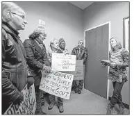  ?? Arkansas Democrat-Gazette/MITCHELL PE MASILUN ?? Sherry Flippo, Constituen­t Services Representa­tive for U.S. Sen. John Boozman, R.-Ark., listens to what concerned citizens have to say about the government shutdown on Friday at the senator’s Little Rock office.