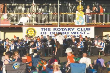  ??  ?? Dubbo District Concert Band playing for the carols