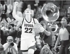  ?? Mary Altaffer Associated Press ?? IOWA GUARD Caitlin Clark had a record-setting season that attracted huge audiences, but fell short against South Carolina in the national championsh­ip.