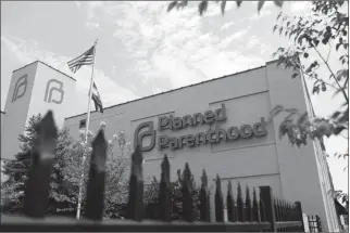  ?? ASSOCIATED PRESS ?? IN THIS JUNE 4 FILE PHOTO, A PLANNED PARENTHOOD CLINIC is photograph­ed in St. Louis. Planned Parenthood says it will leave the federal family planning program by Monday, Aug. 19, unless a court puts a hold on Trump administra­tion rules that bar clinics from referring women for abortions.