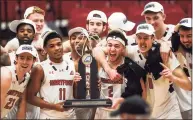  ?? Kassi Jackson / Hartford Courant via AP ?? Hartford players celebrate after beating UMass-Lowell in the America East Tournament championsh­ip game Saturday.