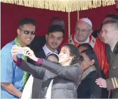  ?? — AFP ?? Pope Francis poses for a selfie at the end of the Palm Sunday mass in St Peter’s square at the Vatican.