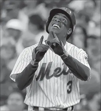  ?? JULIE JACOBSON/AP PHOTO ?? The Mets’ Curtis Granderson reacts after driving in a run on an infield hit against Philadelph­ia during the second inning of Friday’s game at Citi Field. The Mets won, 2-1.
