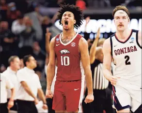  ?? Steph Chambers / Getty Images ?? Arkansas’ Jaylin Williams (10) celebrates a 3-pointer against Gonzaga during the second half of an NCAA Tournament game on Thursday in San Francisco.