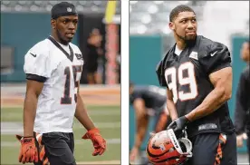  ?? AP PHOTOS BY JOHN MINCHILLO ?? First-round draft pick John Ross has some catching up to do after missing spring workouts. Third-round DE Jordan Willis (99) will compete for snaps behind veterans Carlos Dunlap and Michael Johnson.