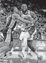  ?? Ronald Cortes/getty Images ?? Keldon Johnson, left, had 26 points and 10 rebounds — both team highs — on Saturday.