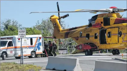  ?? KEITH GOSSE/THE TELEGRAM ?? Medical teams transfer an unresponsi­ve diver from a cormorant helicopter to a waiting ambulance at the Health Sciences Centre Sunday morning.