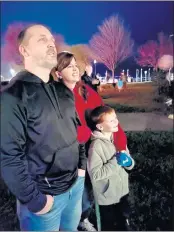  ?? LUCY LLEWELLYN BYARD FOR THE RECORD-BEE ?? The Schmitt family, father Randy, mother Carrie and son Noah enjoy the carols and snow during the first annual Lakeport Blizzard.