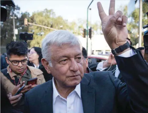  ??  ?? Manuel Lopez Obrador in victory sign, July 1