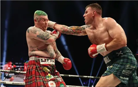  ?? ?? Nick Campbell strikes Jay McFarlane in the clash of the Scottish heavyweigh­ts at the OVO Hydro