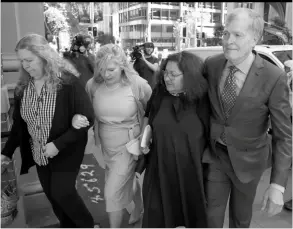  ?? ?? Steve Johnson (right) with his sisters, Terry (left) and Rebecca and his wife Rosemarie (second right) arrive at the Supreme Court in Sydney, Monday