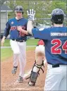  ?? SALTWIRE NETWORK PHOTO ?? Mike MacGilliva­ry of the Sooners is welcomed home by Phil Brown as he scores Sydney’s eighth run in action Sunday against the Truro Bearcats. The Sooners won 11-3 as they swept the Bearcats 3-0 over the weekend to open their Nova Scotia Senior Baseball...