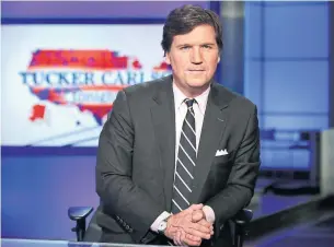  ?? THE ASSOCIATED PRESS FILE PHOTO ?? Tucker Carlson has concluded that disinforma­tion is not coming from conspiracy theories without official websites but from “cable news” and “politician­s talking on TV,” Vinay Menon writes.