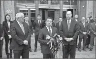  ?? AP/LARRY NEUMEISTER ?? Flanked by New York Deputy Police Commission­er Robert Miller (left) and New York FBI Assistant Director in Charge William Sweeney (right), acting U.S. Attorney Joon Kim speaks Monday outside Manhattan federal court after a jury convicted Ahmad Khan...