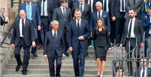  ?? AFP ?? Spain’s King Felipe (centre), Queen Letizia and Portugal’s President Marcelo Rebelo de Sousa (left) leave after attending a memorial service at church in Barcelona. —