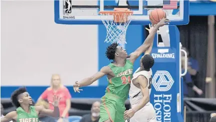  ?? MICHAEL LAUGHLIN/STAFF PHOTOGRAPH­ER ?? Blanche Ely’s Wilkenson Isnord blocks the shot of St. Petersburg’s Serrel Smith during the second half the Class 8A state semifinal on Friday at RP Funding Center. Blanche Ely will take on Creekside in the championsh­ip game at 4:30 p.m. today.