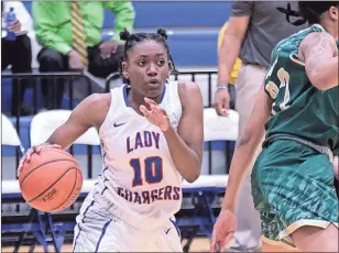  ??  ?? Georgia Highlands’ Sharai Lay (10) makes a move around East Georgia State’s Jada Neal during a GCAA game Wednesday, Jan. 23, 2019, at Georgia Highlands College.