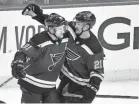  ?? JEFF CURRY/USA TODAY SPORTS ?? Blues right wing Vladimir Tarasenko, left, is congratula­ted by center Tyler Bozak after his first-period goal Tuesday.