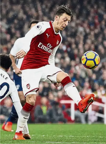  ??  ?? Raising the bar: Arsenal’s Mesut Ozil was outstandin­g in last weekend’s north London derby victory over Tottenham Hotspur. — AP