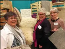  ?? PAUL POST — PPOST@DIGITALFIR­STMEDIA.COM ?? Lilly Marsh, Mary Jeanne Packer and Hudson Valley Textile Project President Gail Parrinello, left to right, admire the many types of products people may find on this weekend’s 26th annual Washington County Fiber Tour. People may take a self-guided tour of nine farms and a processing mill from 10 a.m. to 4 p.m. Saturday and Sunday. Separately, the Textile Project is one of many businesses taking part in this week’s Adirondack North Country Associatio­n two-day buyers’ fair at Saratoga Springs City Center.