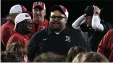  ?? ?? Milford football coach Garfrey Smith speaks to his team following Friday’s 18-15win over Walled Lake Western. The Mavericks are 4-1and off to their best start since 2010.