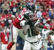  ?? TONY GUTIERREZ — THE ASSOCIATED PRESS ?? Jeremy Maclin catches a 52-yard pass in the second quarter of the Eagles win over the Texans Sunday.