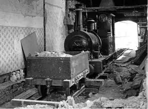  ?? TR ARCHIVES ?? Loco No. 2 Dolgoch inside the extended engine shed. The former cottage’s floral wallpaper is still visible.