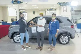  ??  ?? Pepsi ‘Riddim Mania’ grand prize winner, Oshan Martin (centre), receives the key to her 2020 Hyundai Venue valued at $4.6 million from Pepsi’s Marketing Coordinato­r Ever-gaye Style-morris (right) and Hyundai’s Customer Relationsh­ip Officer Cassi Wright.