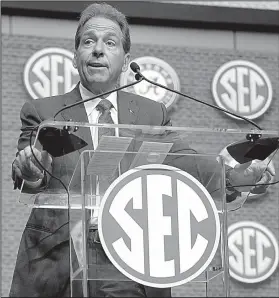  ?? AP/JOHN BAZEMORE ?? Alabama Coach Nick Saban, shown speaking at the SEC media days in Atlanta on Wednesday, said he has no plans to retire soon because his wife, Terry, is not ready for him to spend more time around the house. “Mrs. Terry doesn’t want me at home,” said Saban, 66. “I can tell you that. She doesn’t care if I’m 60, 70 or 80.”