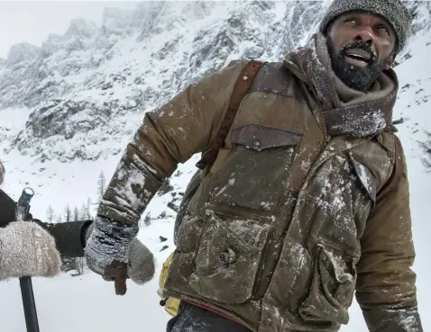  ??  ?? Cold front: Kate Winslet and Idris Elba filming The Mountain Between Us in British Columbia