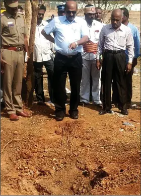  ??  ?? Crater: Officials examine the site of the apparent meteorite strike