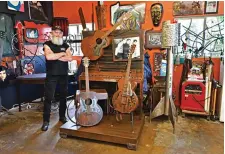  ?? Submitted photo ?? Wayne Summerhill, at his studio, stands alongside some of his musically inspired metal sculptures.