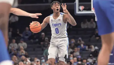  ?? JOE RONDONE/THE COMMERCIAL APPEAL ?? Memphis Tigers guard Earl Timberlake brings the ball up court as they take on the Tulsa Golden Hurricane at Fedexforum on Tuesday, Jan. 4, 2022.