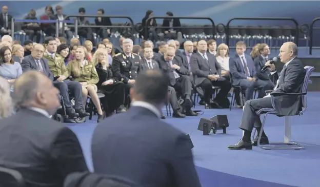  ?? PICTURE: ALEXEI NIKOLSKY ?? 0 Russian President Vladimir Putin speaks to supporters during a meeting for his campaign in Moscow