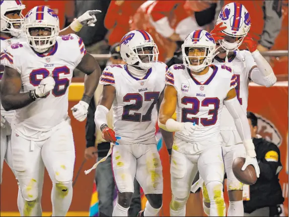  ?? The Associated Press ?? Charlie Riedel
Buffalo Bills safety Micah Hyde (23) is congratula­ted after his intercepti­on return for a TD against the Kansas City Chiefs on Oct. 10.