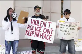  ?? RAY CHAVEZ — BAY AREA NEWS GROUP VIA AP ?? Protesters gather outside the courthouse in Martinez on Friday during a hearing to determine whether multiple police officers who traded racist text messages violated a state law aimed at eliminatin­g racism in the criminal justice system.