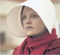  ?? GEORGE KRAYCHYK HULU ?? Elisabeth Moss as Offred in the Emmy-nominated series The Handmaid's Tale, produced by another online streamer, Hulu.