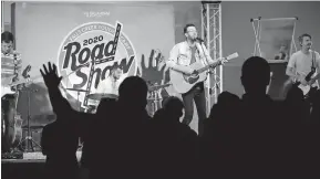  ??  ?? Cody Dunbar sings during the “Falls Creek Road Show” at First Baptist Church of Cushing.
