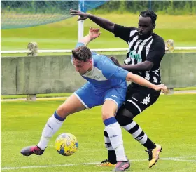  ?? Picture: Dan Regan ?? Action from last weekend’s match between Cribbs Causeway, in blue, and Chipping Sodbury. The visitors Chipping Sodbury won 2-1