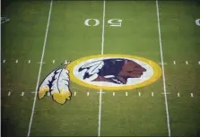  ?? NICK WASS - THE ASSOCIATED PRESS ?? In this Aug. 28, 2009 file photo, the Washington Redskins logo is shown on the field before the start of a preseason NFL football game against the New England Patriots in Landover, Md.