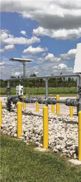  ??  ?? Thomas McAndrew, CEO of Enchanted Rock Energy, checks on a natural gas generator installed at an H-E-B store in Houston. Enchanted Rock has developed new technology and a new business model that will make emergency generation more affordable for companies like H-E-B.