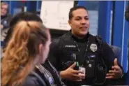  ?? ERIC BONZAR—THE MORNING JOURNAL ?? Lorain police and Community Resource Officer Reuben Figueroa shares his input regarding student transition into higher grades during the district’s monthly Community Business Schools partnershi­p meeting, March 21.