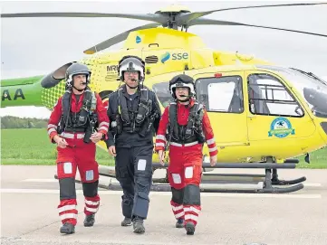  ?? ?? LIFESAVING CREW: From left: Lead paramedic John Pritchard, pilot Captain Russell Myles and paramedic Ali Daw.