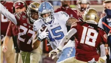  ?? DON JUAN MOORE/ CHARACTER LINES ?? UNC senior receiver Beau Corrales ( 15), who had four catches for 141 yards and a touchdown in last week’s loss at Florida State, is one of several weapons available to quarterbac­k Sam Howell.